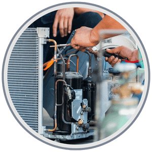 AC & Heating Tune-Up Special 6 HVAC technician performing a full system inspection on a residential furnace