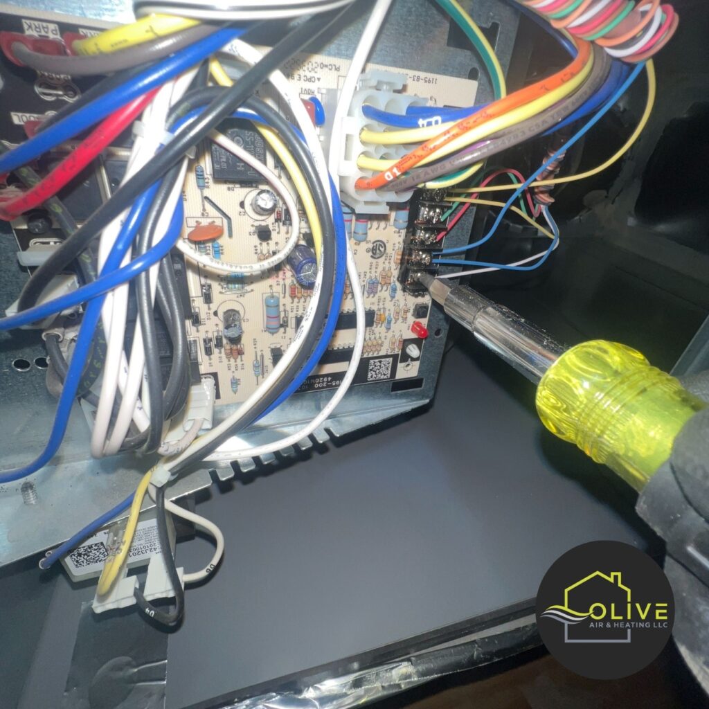 A close-up image of a technician working on the complex electrical wiring of an AC unit. In older units, frequent electrical issues can lead to increased repair costs and reduced efficiency. Replacing the unit with a newer, more energy-efficient model may be a more cost-effective long-term solution. AC Repair