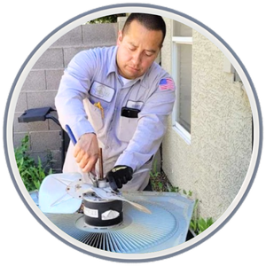 This image shows an Olive Air & Heating technician meticulously cleaning an HVAC fan, exemplifying their prompt and reliable AC repair services in Gilbert, AZ.