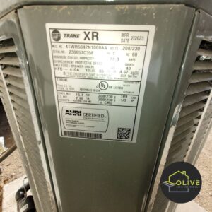 Close-up of a Trane XR AC unit nameplate, emphasizing the importance of regular maintenance and AC tune up specials near me for optimal system performance.