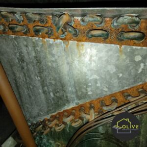 A rusted and corroded AC evaporator coil showing signs of damage and inefficiency. An Affordable AC Contractor can replace or repair coils to restore cooling performance.
